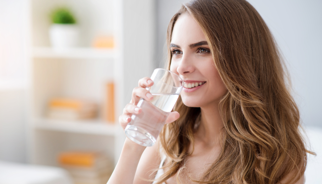 women drinking water - works best for constipation